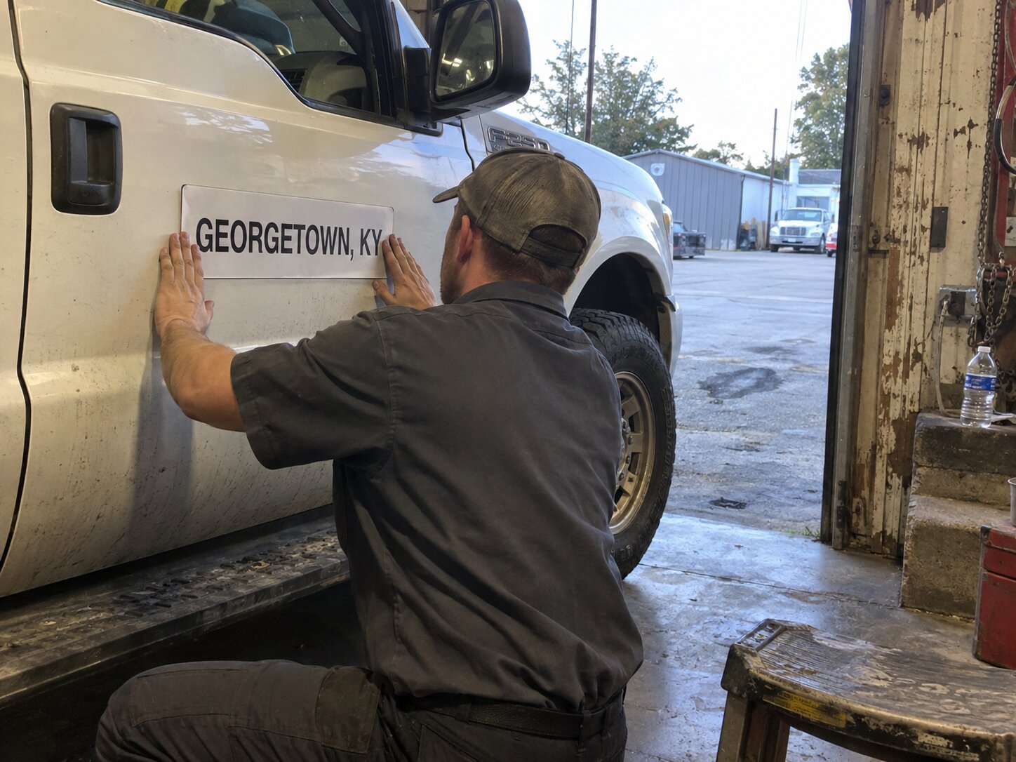 Applying a city name magnet before a service area job in Georgetown Ky by Lexington Heating and Air