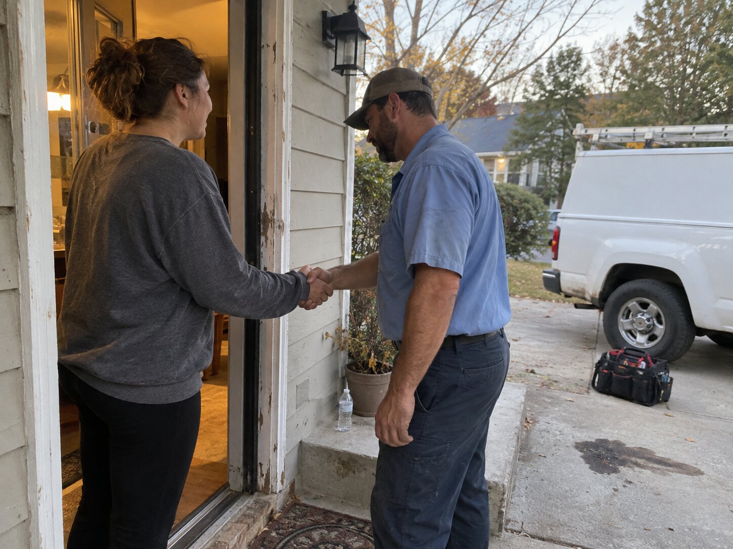 Handshake at the end of a completed home service job by Lexington Heating and Air