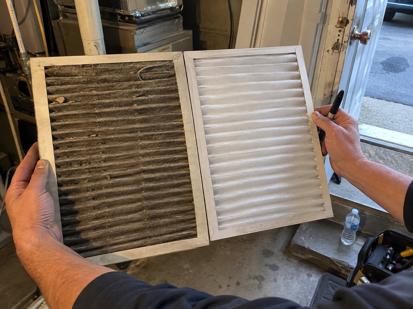 Comparing an old dirty filter to a new one by Lexington Heating and Air