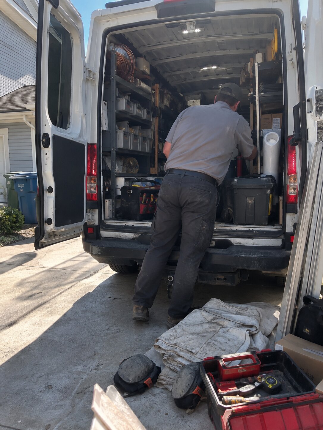 Stocked HVAC service van in a driveway in Installation by Lexington Heating and Air