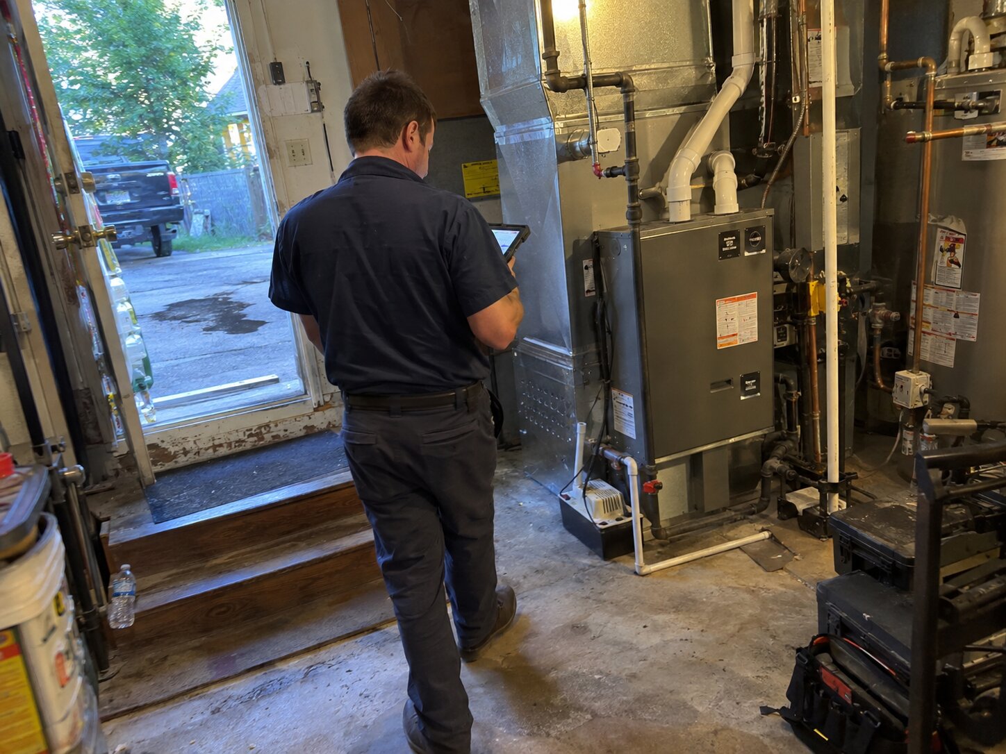 Residential HVAC maintenance walkthrough with a tablet checklist by Lexington Heating and Air