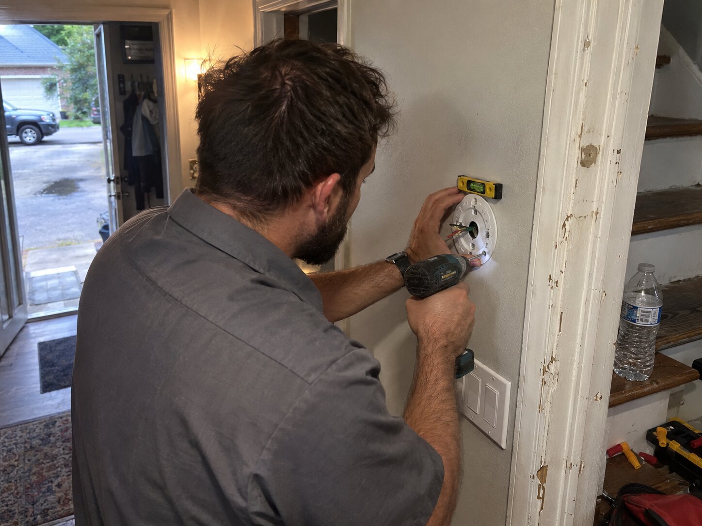 Mounting a new smart thermostat base to a wall in Installation by Lexington Heating and Air