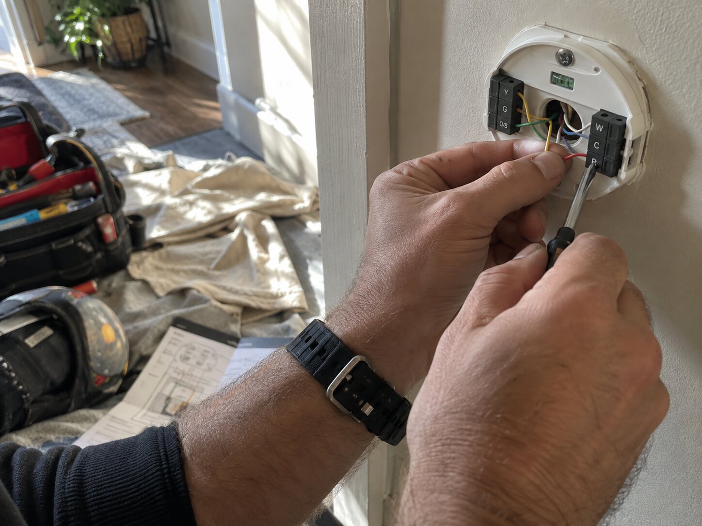Connecting labeled wires to a smart thermostat sub-base in Installation by Lexington Heating and Air