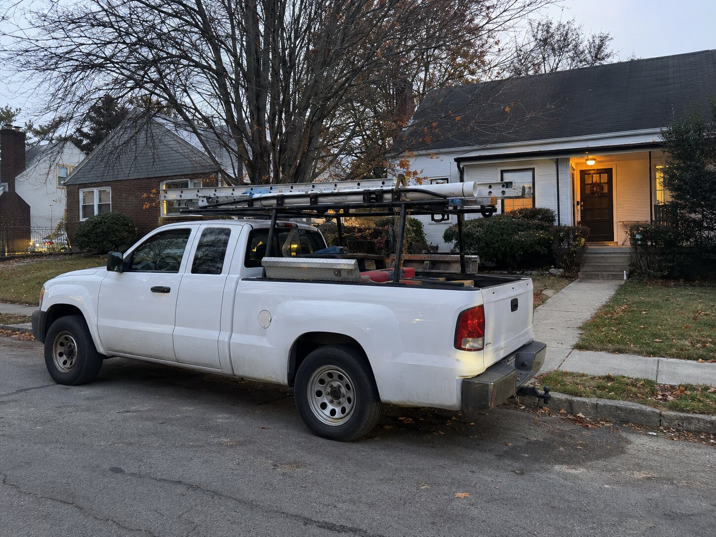 Work truck parked on a residential street by Lexington Heating and Air