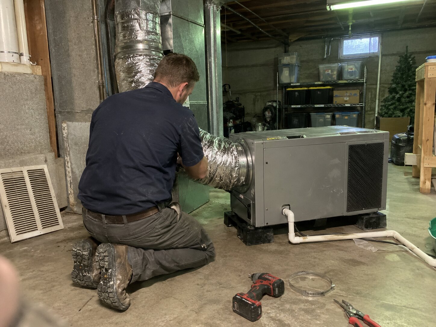 Installing a whole-home dehumidifier as part of an IAQ package in Carbon Monoxide Testing by Lexington Heating and Air
